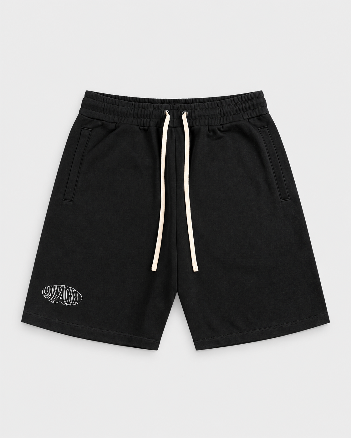 Studio Emblem Shorts, front on light grey