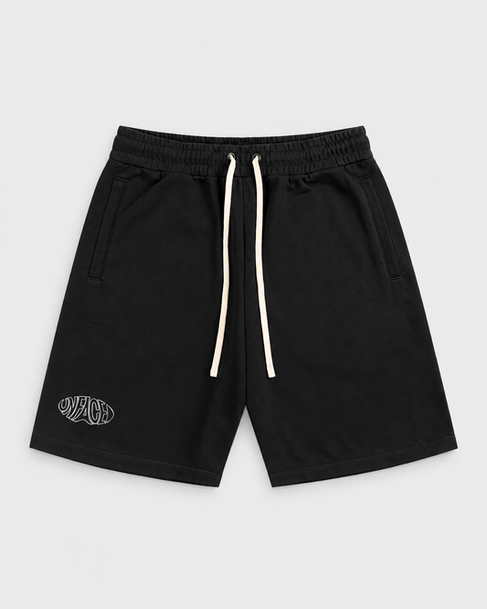 Studio Emblem Shorts, front on light grey