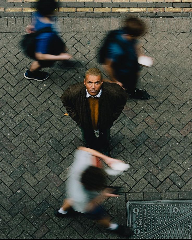 A person looking upward as the city moves around them